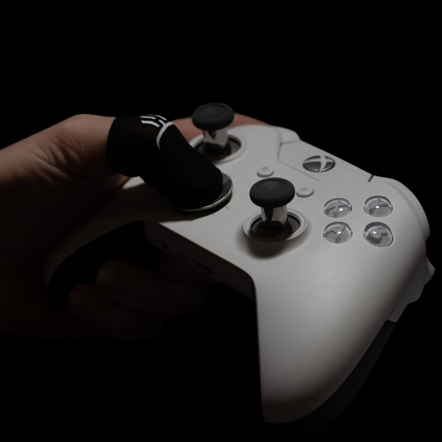 Carbon fiber GripSticks finger sleeves used on Xbox controller for improved grip and control