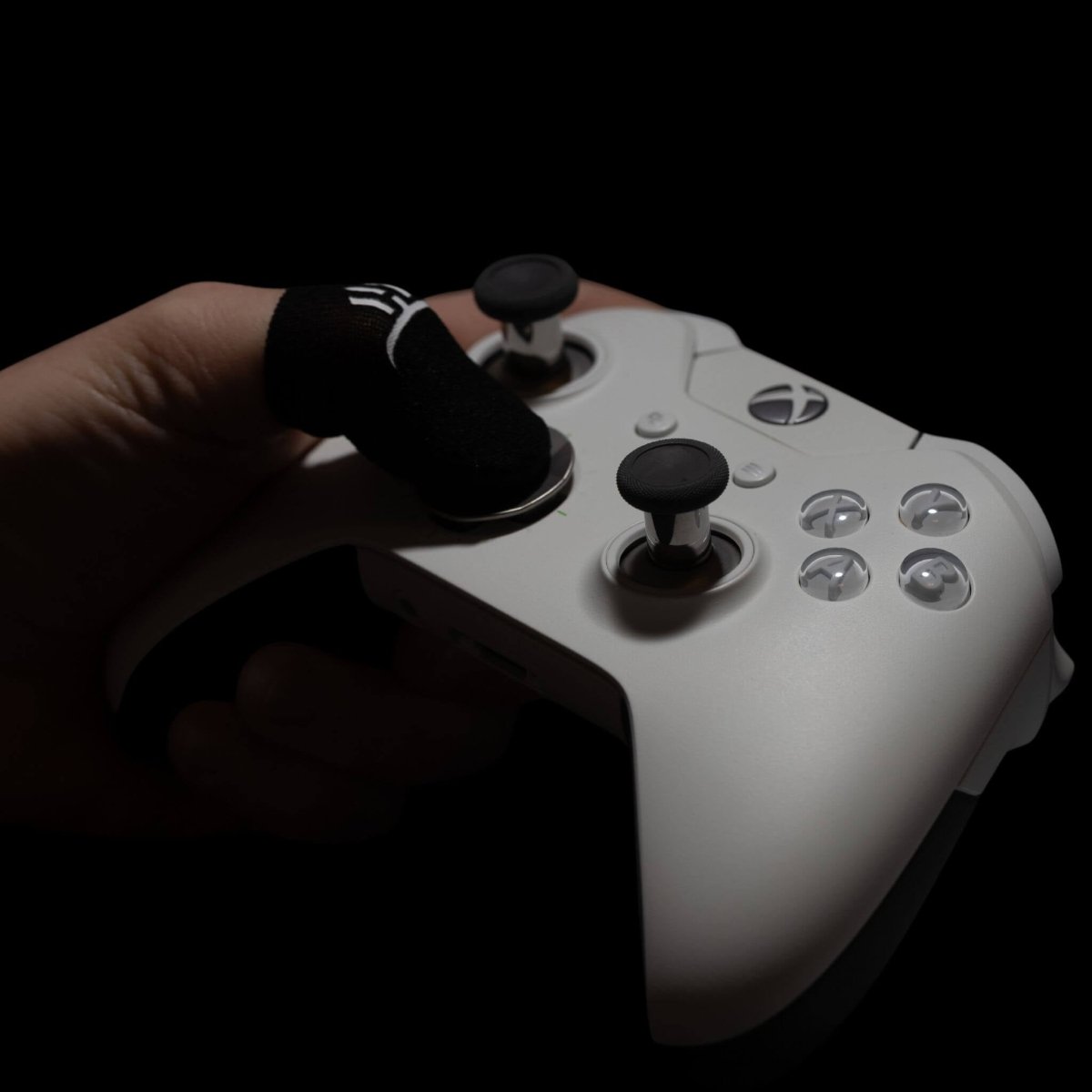 Carbon fiber GripSticks finger sleeves used on Xbox controller for improved grip and control